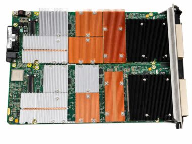 Top-down view of a refurbished Ixia Xcellon-Lava AP40/100GE 2P load module board showing its FPGA array and copper heatsinks